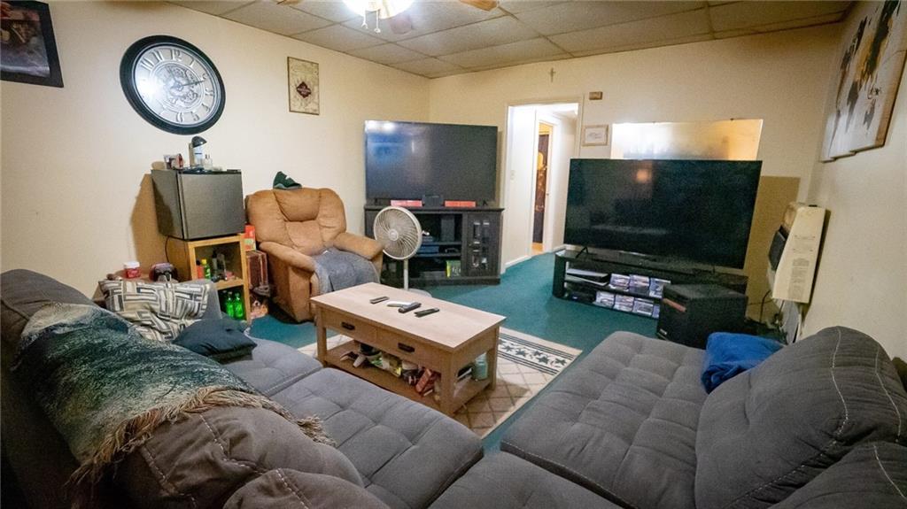 135 Hickory Street Butler, PA 16001 - Photo 10 of 25 a living room with furniture and a flat screen tv