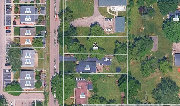 an aerial view of multiple houses with outdoor space