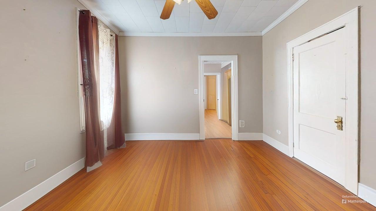 71-50 73rd Place Queens, NY 11385 - Photo 16 of 24 Spare room featuring crown molding, baseboards, light wood-style floors, and a ceiling fan