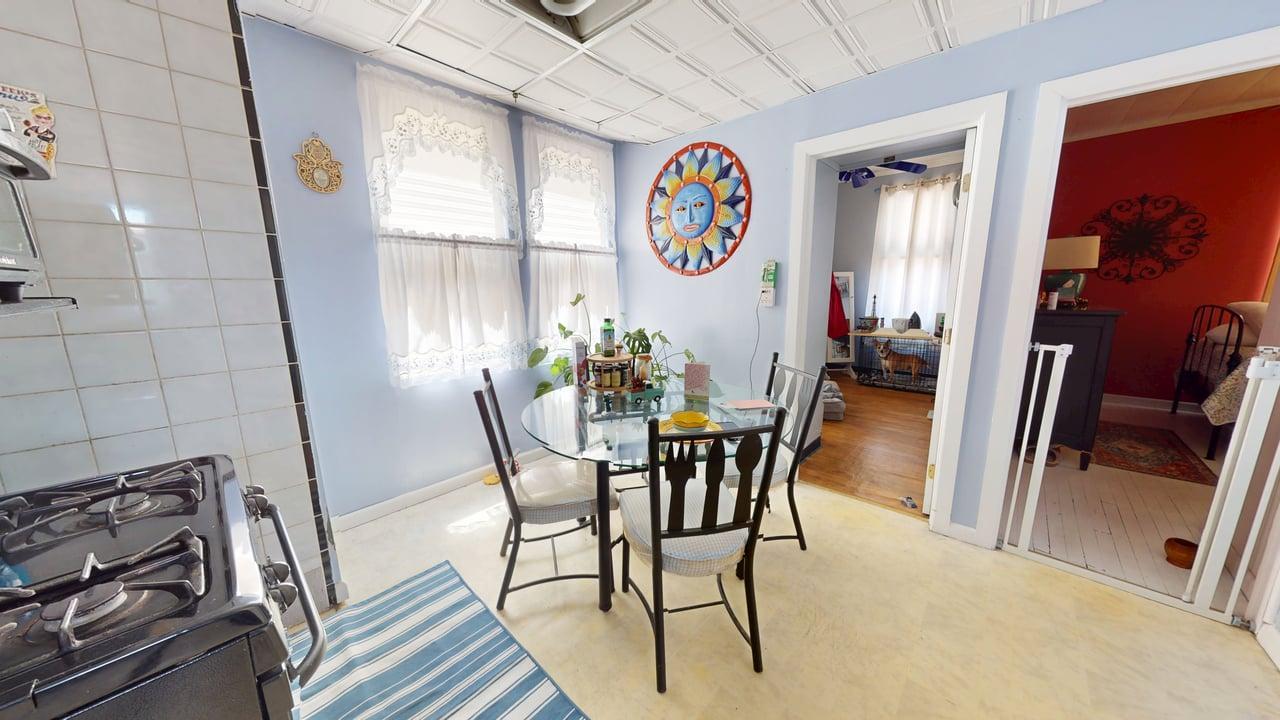 71-50 73rd Place Queens, NY 11385 - Photo 8 of 24 Dining room featuring baseboards