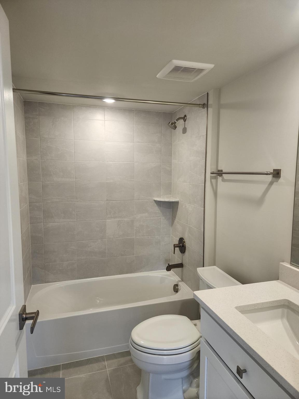 2111 Collington Place Laurel, MD 20708 - Photo 13 of 25 a bathroom with a granite countertop bathtub shower sink vanity and toilet