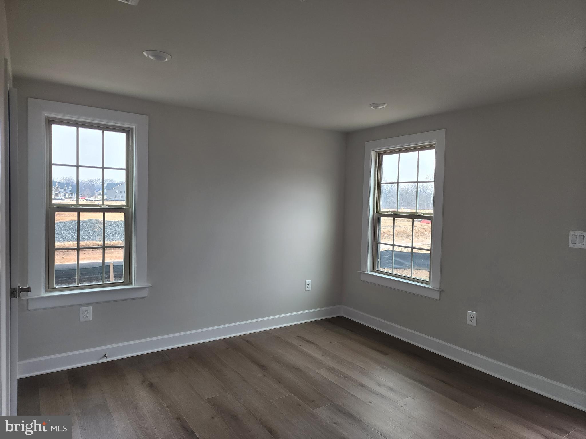 2111 Collington Place Laurel, MD 20708 - Photo 14 of 25 an empty room with wooden floor and windows