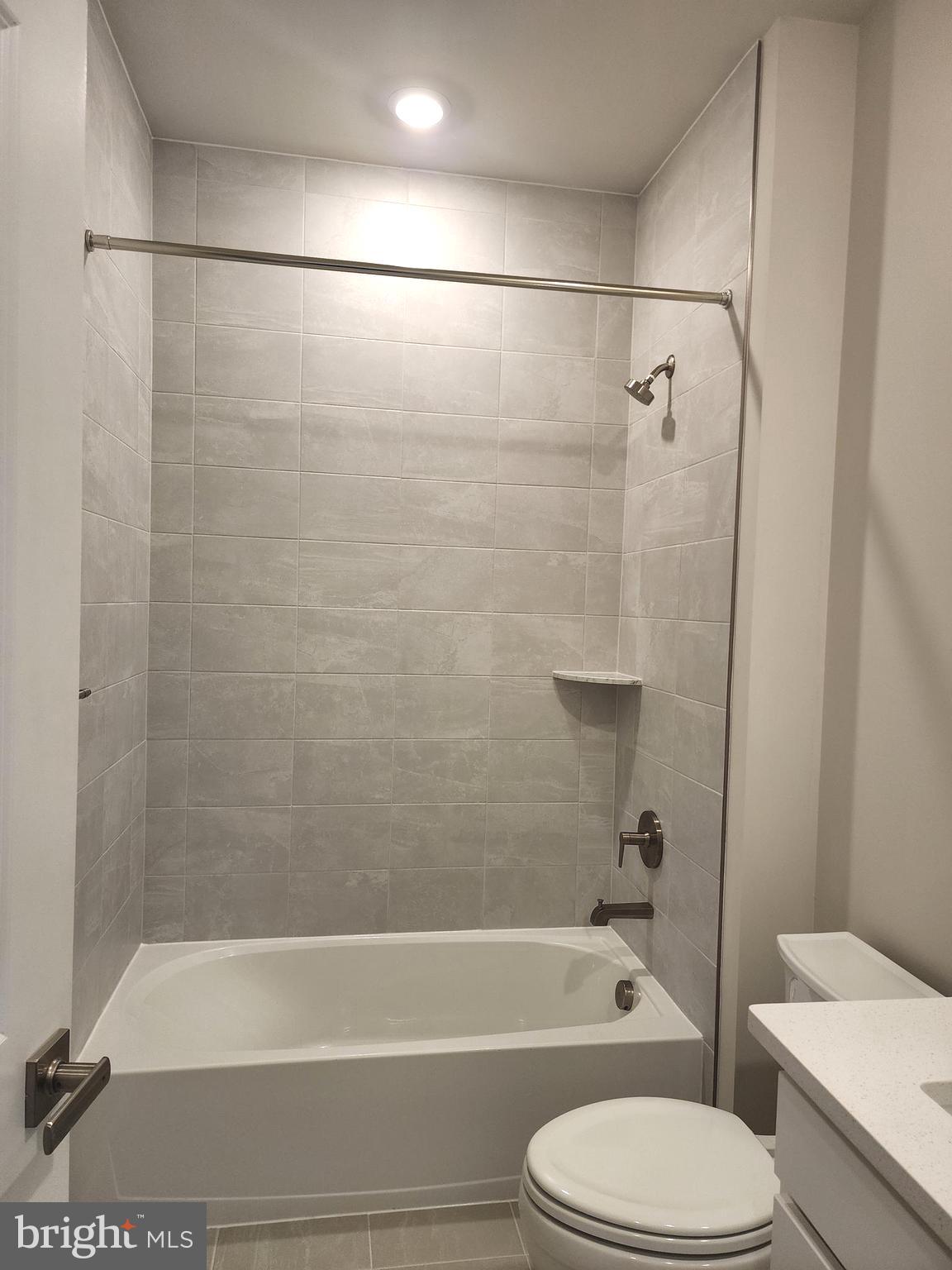 2111 Collington Place Laurel, MD 20708 - Photo 16 of 25 a bathroom with a toilet and a bath tub