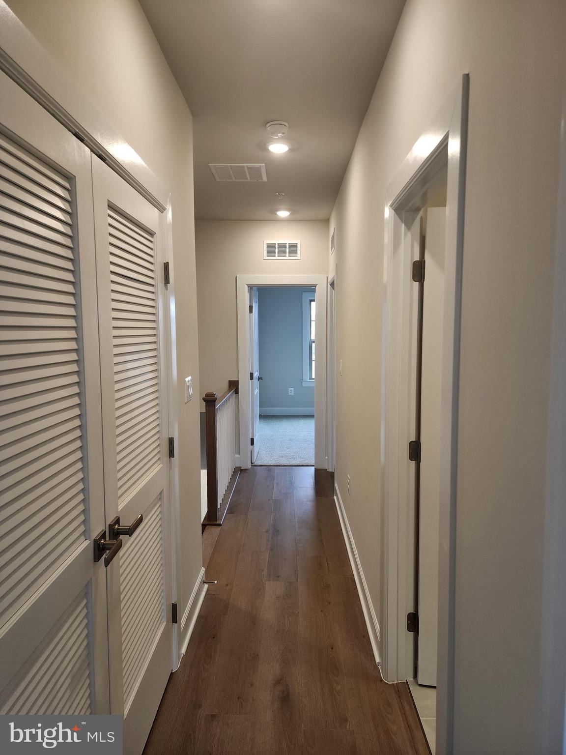 2111 Collington Place Laurel, MD 20708 - Photo 19 of 25 a view of a hallway view with wooden floor and staircase