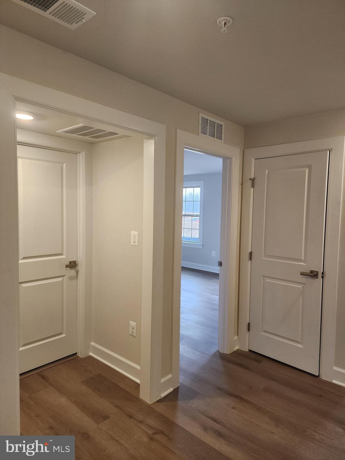 2111 Collington Place Laurel, MD 20708 - Photo 8 of 25 a view of an empty room with wooden floor