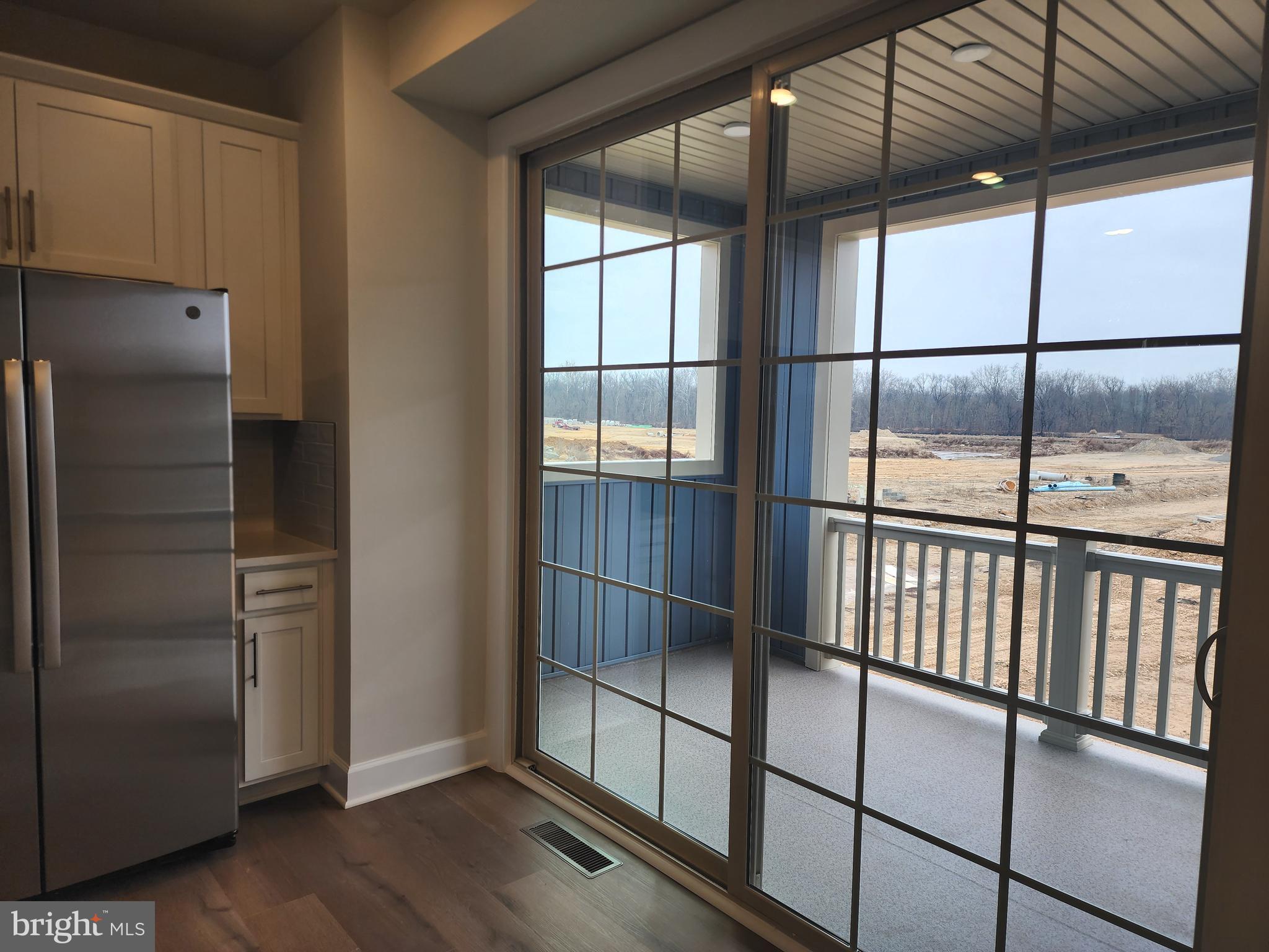 2111 Collington Place Laurel, MD 20708 - Photo 9 of 25 a view of empty room with wooden floor and fan