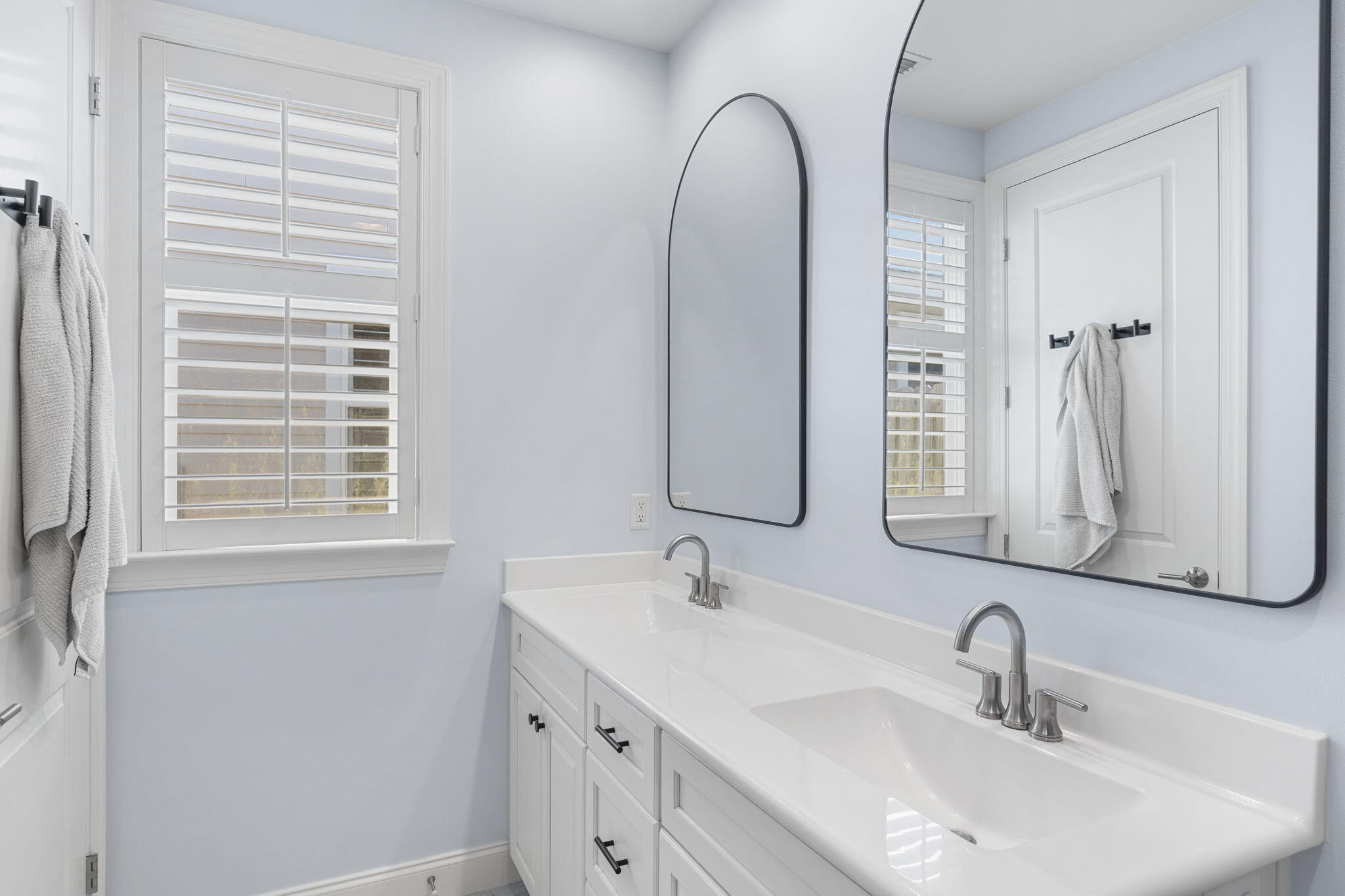 74 Chapman Street Santa Rosa Beach, FL 32459 - Photo 20 of 38 a bathroom with a double vanity sink and a mirror