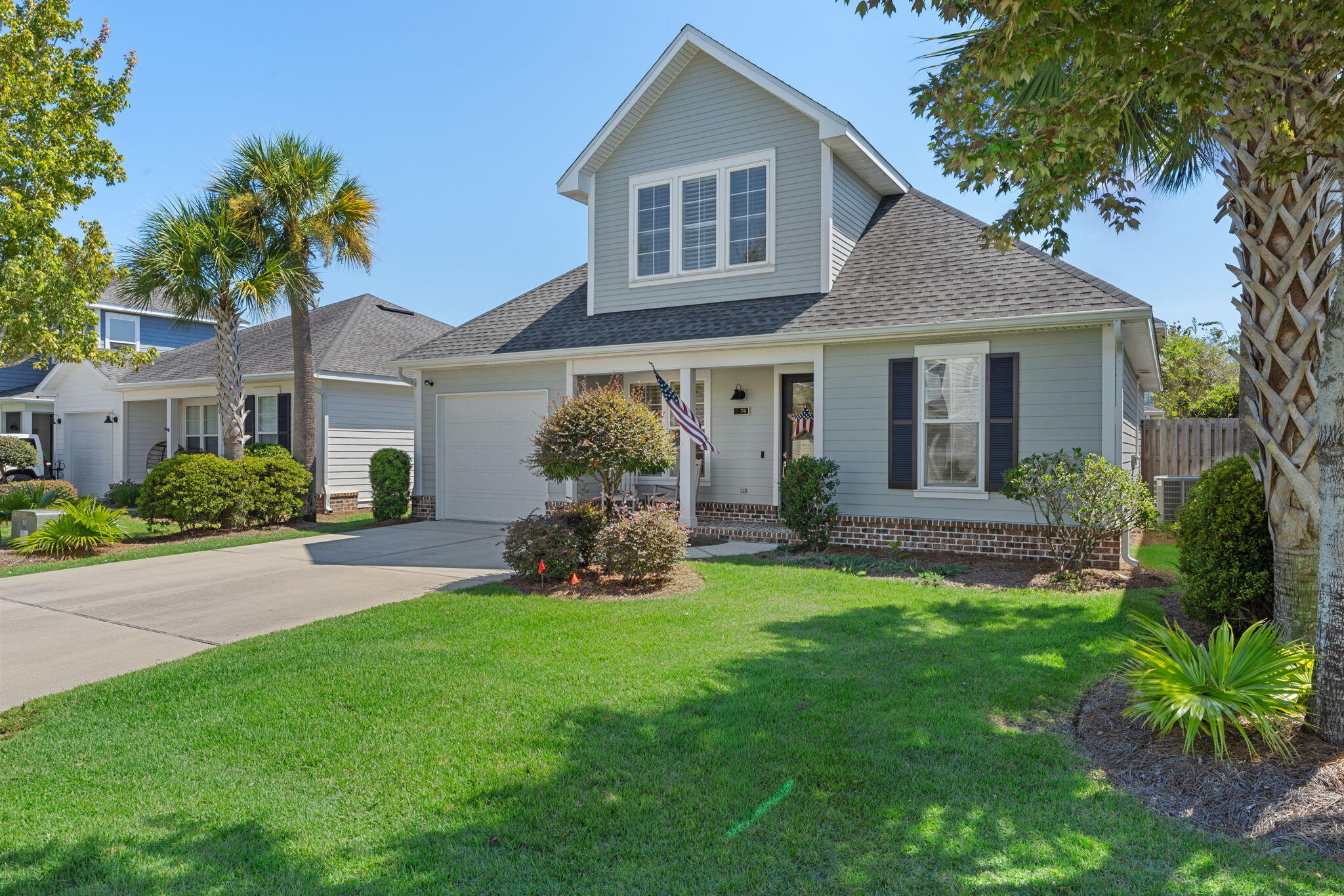 74 Chapman Street Santa Rosa Beach, FL 32459 - Photo 3 of 38 a view of a house with a yard and sitting area