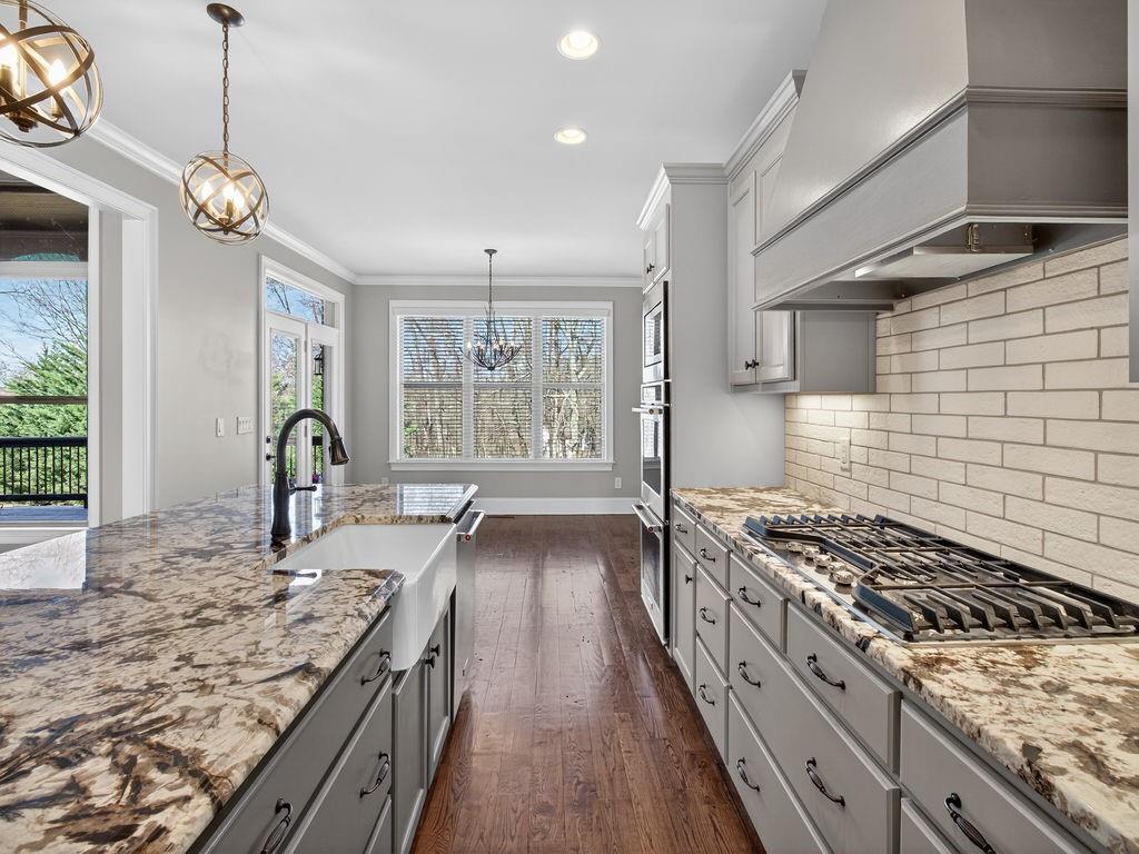 436 Thunder Road Buford, GA 30518 - Photo 15 of 62 a kitchen with a stove and a sink