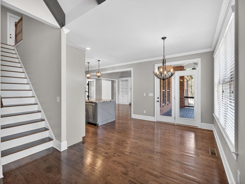 436 Thunder Road Buford, GA 30518 - Photo 17 of 62 a view of a hallway view with wooden floor and staircase