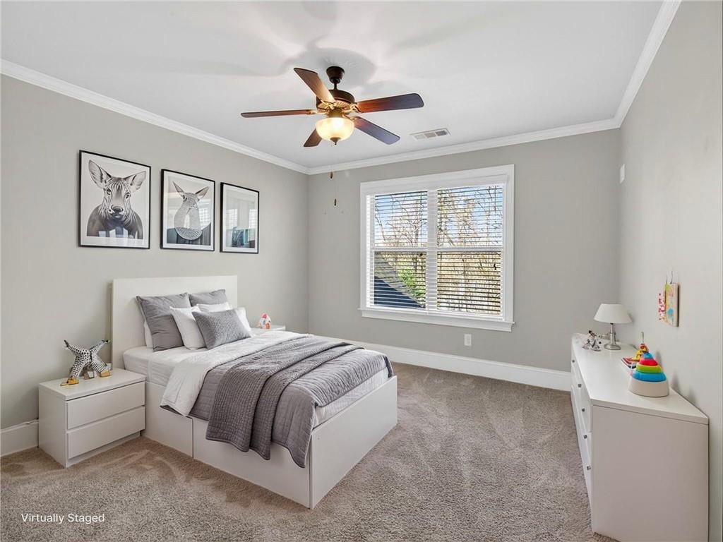 436 Thunder Road Buford, GA 30518 - Photo 21 of 62 a bedroom with a bed and a window