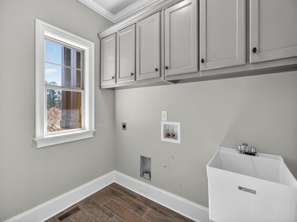 436 Thunder Road Buford, GA 30518 - Photo 24 of 62 a view of storage and utility room with wooden floor and cabinets