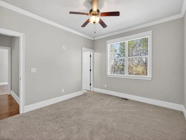 a view of kitchen and living room with wooden floor