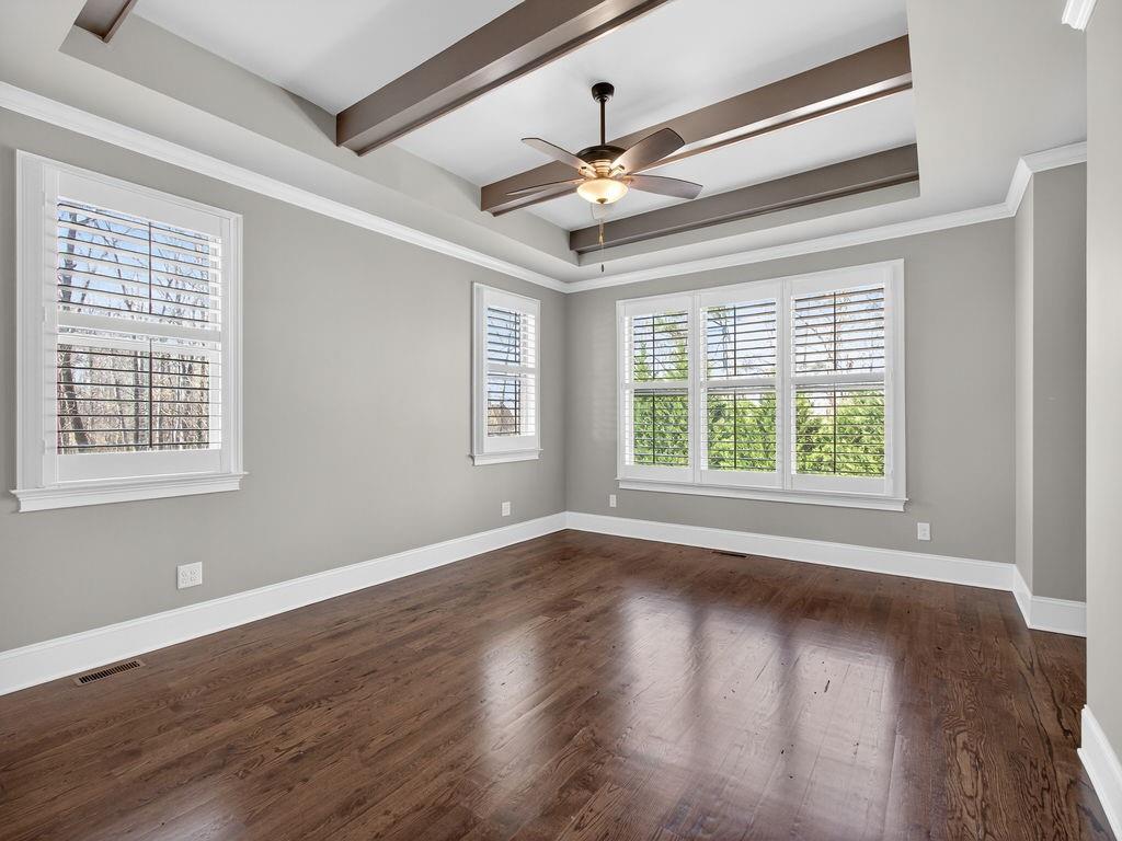 436 Thunder Road Buford, GA 30518 - Photo 32 of 62 a view of an empty room with wooden floor and a window