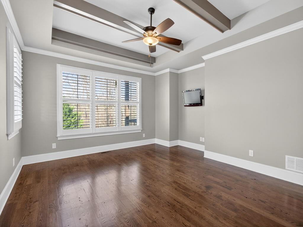 436 Thunder Road Buford, GA 30518 - Photo 34 of 62 a view of an empty room with wooden floor and a window