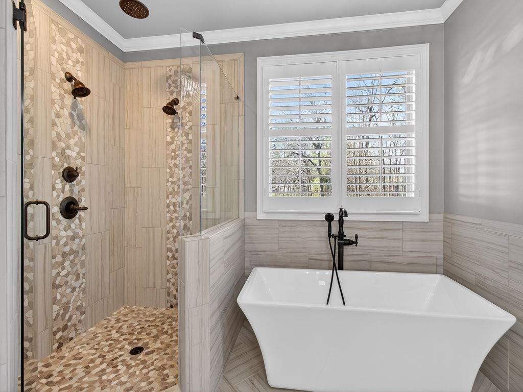 436 Thunder Road Buford, GA 30518 - Photo 37 of 62 a bathroom with a bathtub and shower