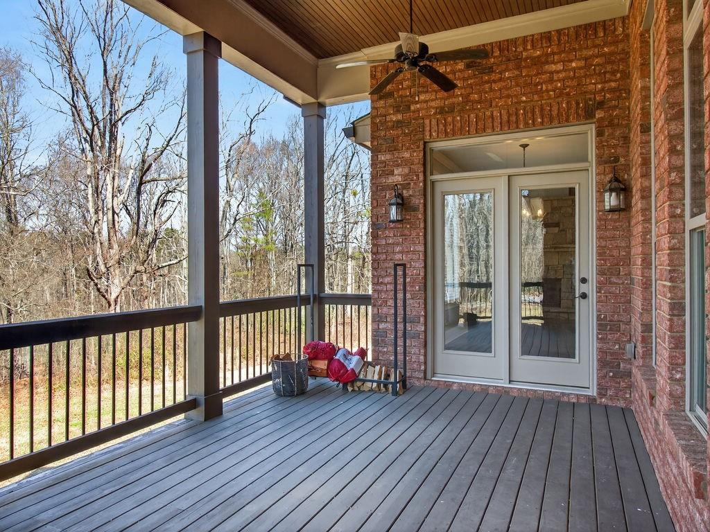 436 Thunder Road Buford, GA 30518 - Photo 40 of 62 a view of a porch with wooden floor