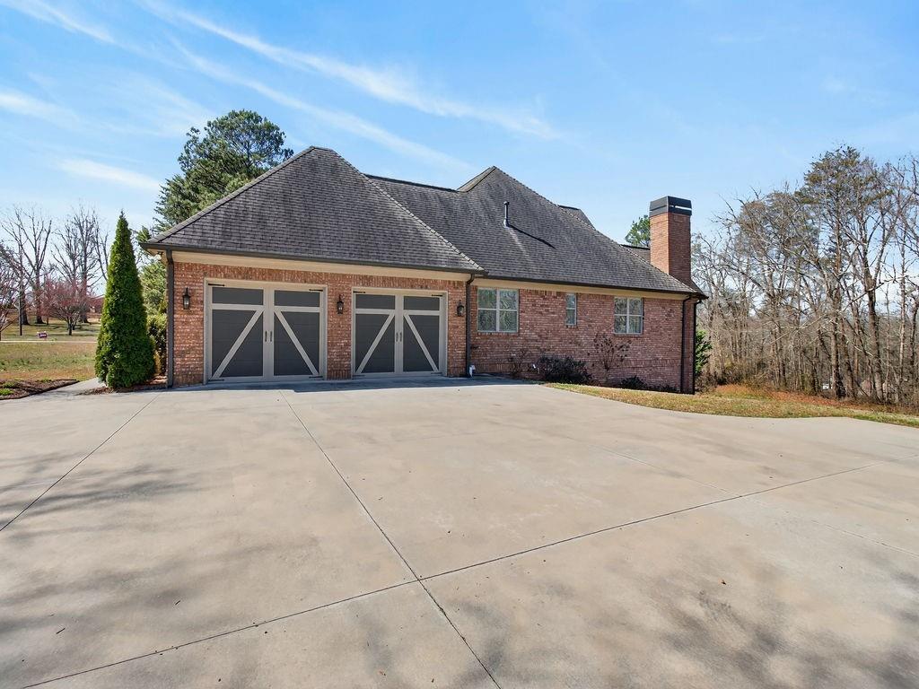436 Thunder Road Buford, GA 30518 - Photo 55 of 62 a front view of a house with a yard and garage