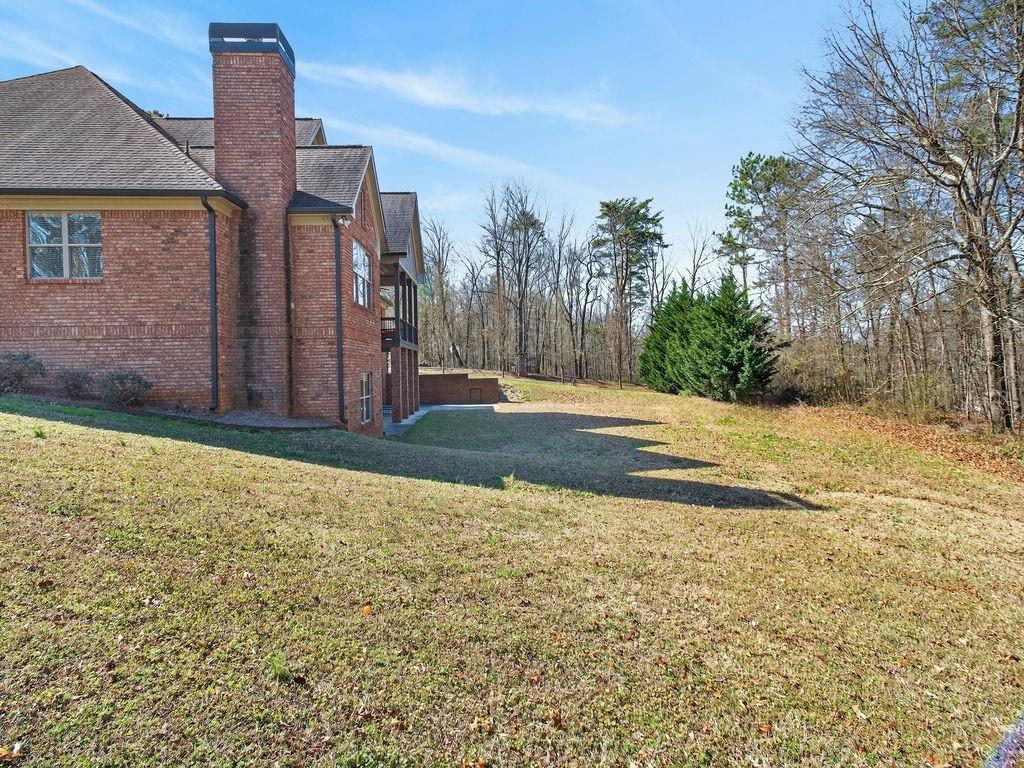 436 Thunder Road Buford, GA 30518 - Photo 56 of 62 a backyard of a house with lots of green space