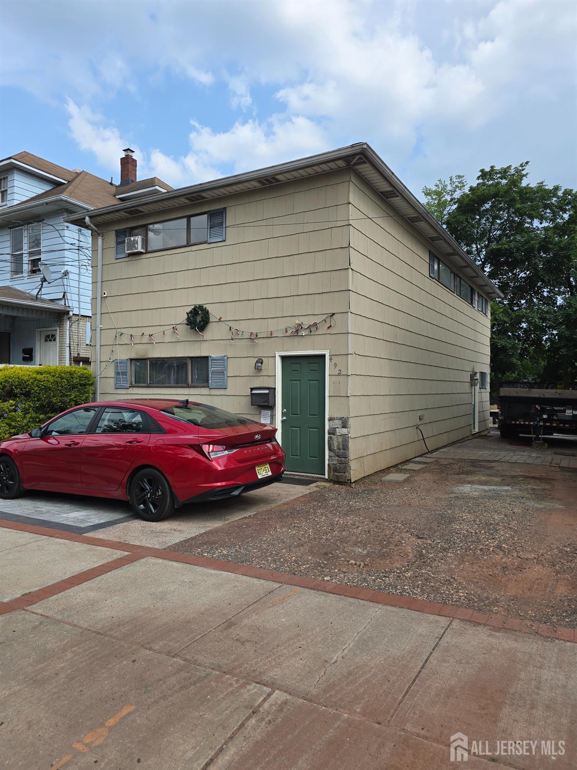 492 Hamilton Street Somerset, NJ 08873 - Photo 1 of 1 a car parked in front of a house