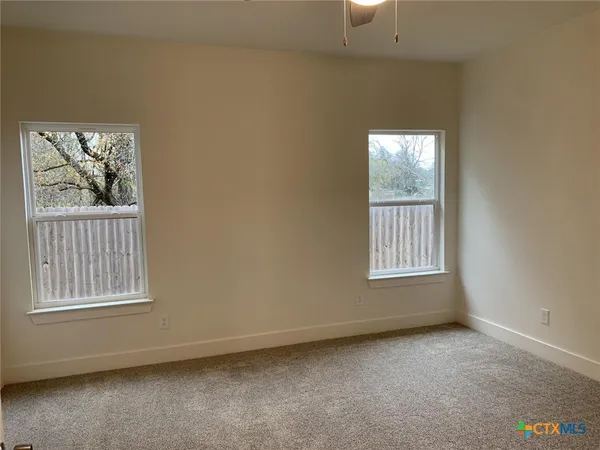an empty room with windows