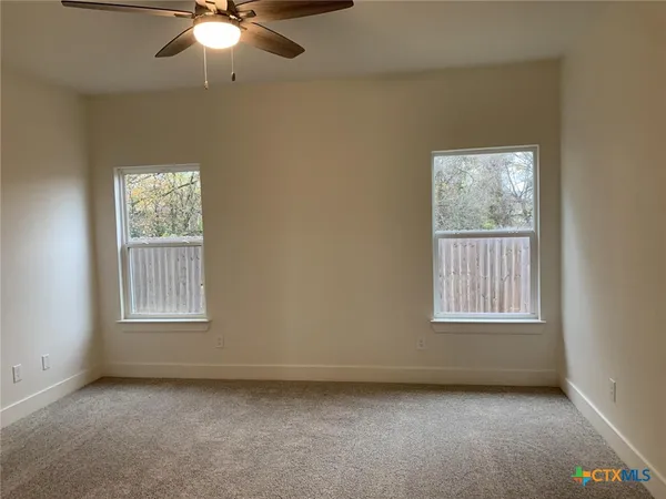 an empty room with windows