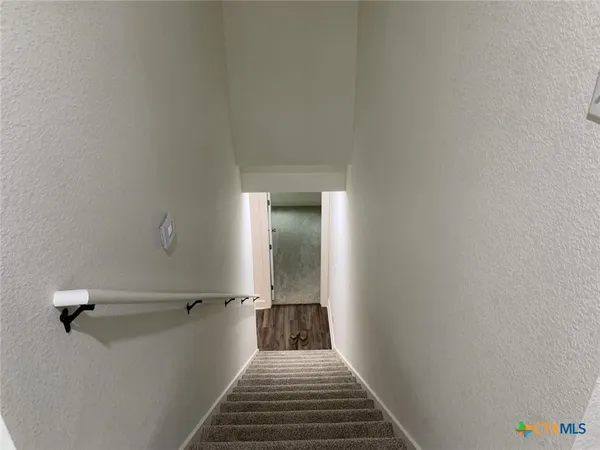 a view of a hallway with a white walls