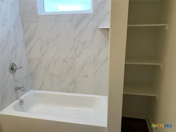 a bathroom with a bathtub