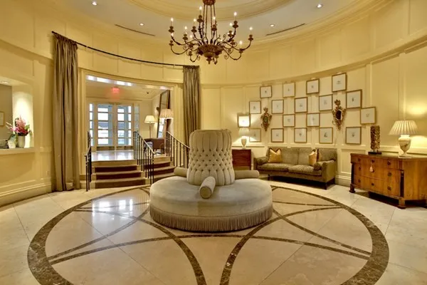 a living room with furniture and a chandelier