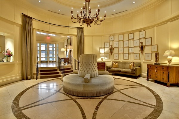 1 Huntington Avenue, Unit 401 Boston, MA 02116 - Photo 11 of 11 a living room with furniture and a chandelier