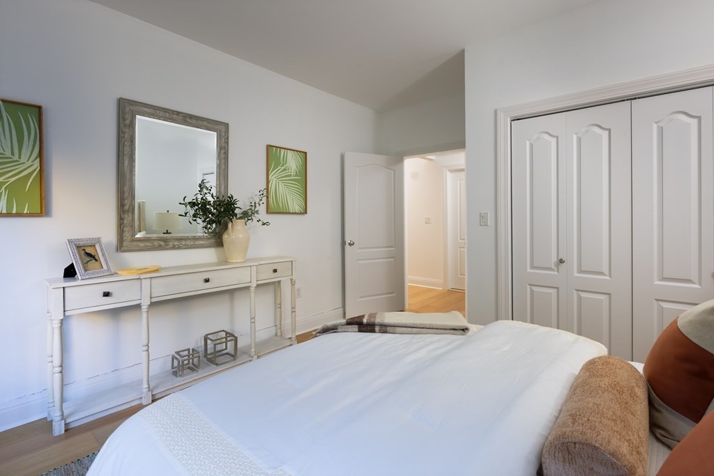 1 Huntington Avenue, Unit 401 Boston, MA 02116 - Photo 7 of 11 a bedroom with a bed and a dresser