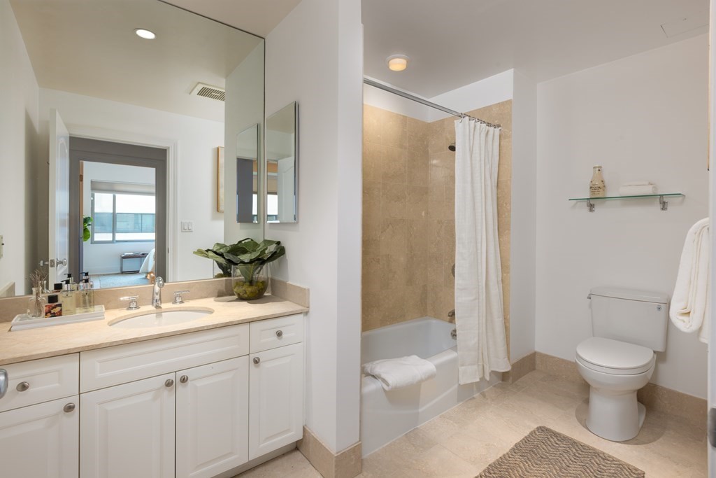 1 Huntington Avenue, Unit 401 Boston, MA 02116 - Photo 8 of 11 a bathroom with a sink a toilet and shower