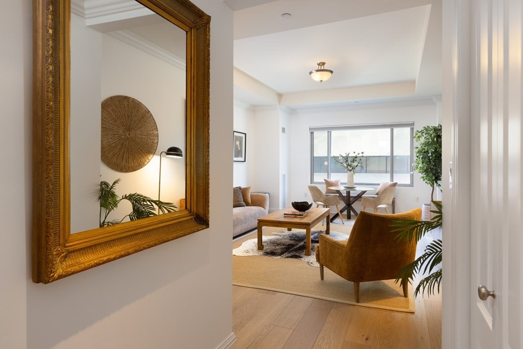 1 Huntington Avenue, Unit 401 Boston, MA 02116 - Photo 9 of 11 a living room with furniture and a window