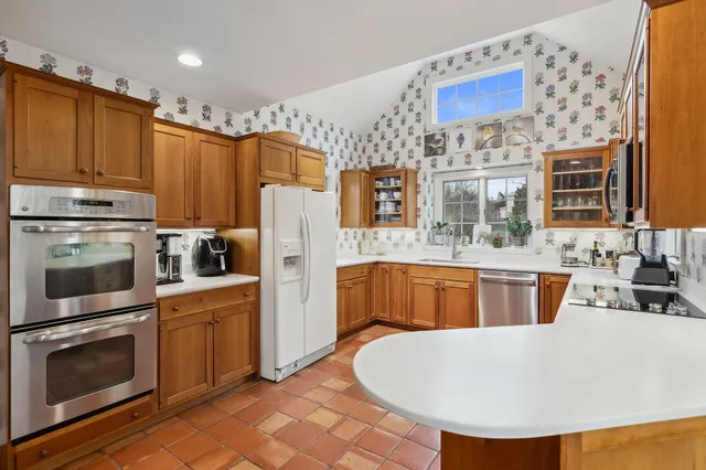 a view of water heater and covered with wooden floor