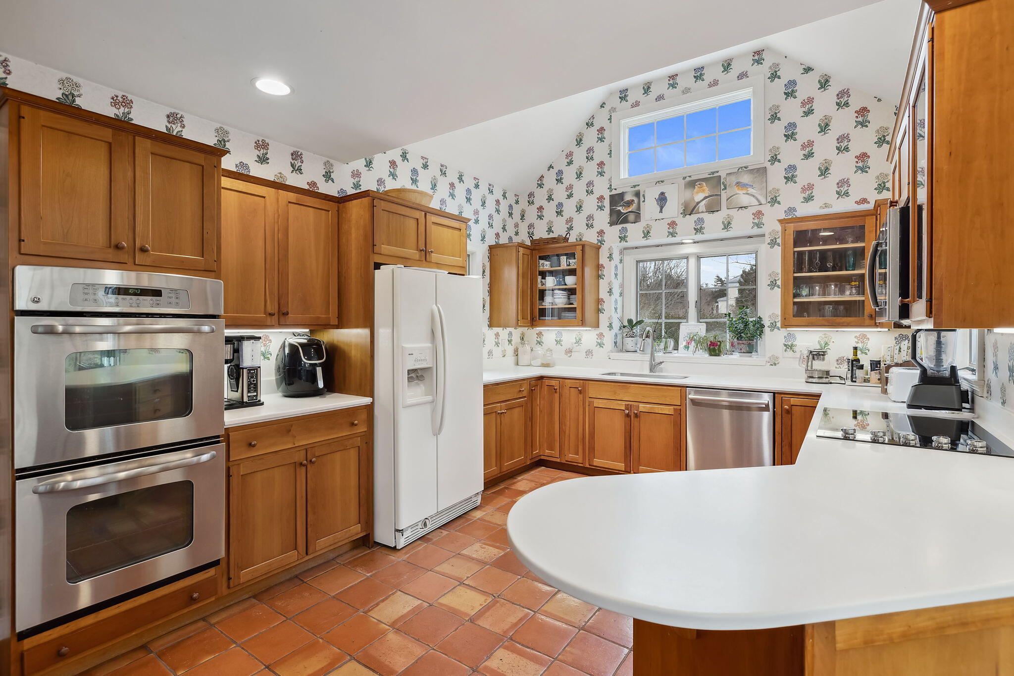 46 Freeman Lane Orleans, MA 02653 - Photo 23 of 74 a kitchen with stainless steel appliances a stove a sink dishwasher a refrigerator and a oven with wooden floor