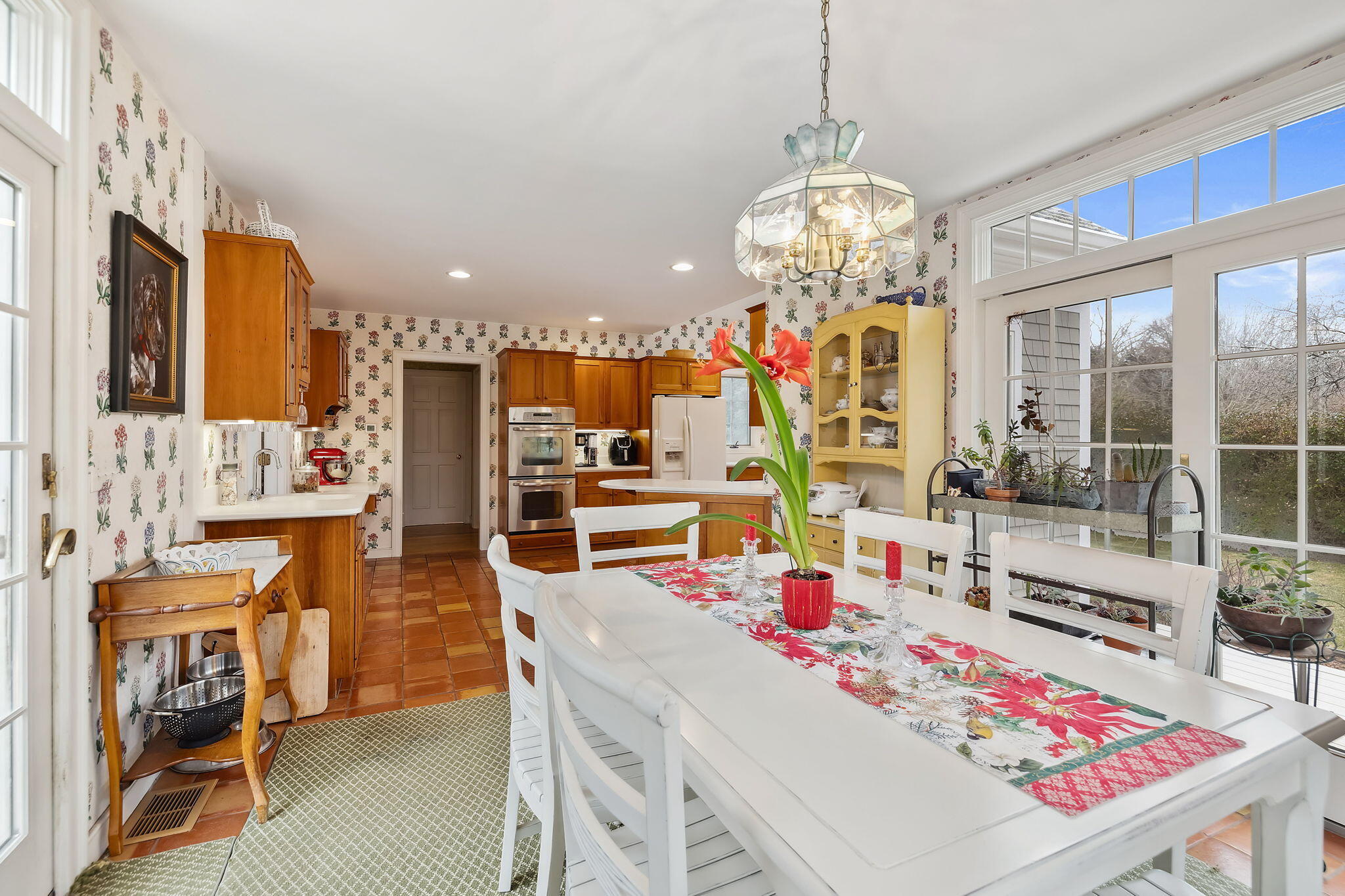46 Freeman Lane Orleans, MA 02653 - Photo 24 of 74 a view of a dining room with furniture and a chandelier