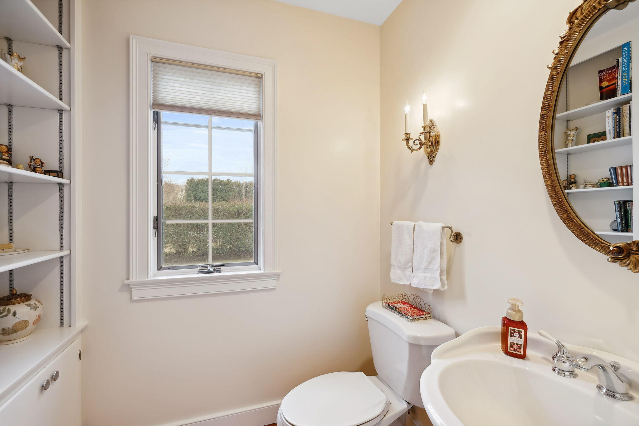 46 Freeman Lane Orleans, MA 02653 - Photo 29 of 74 a bathroom with a toilet sink and mirror