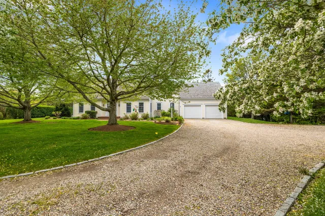 a kitchen with stainless steel appliances granite countertop a refrigerator and a stove