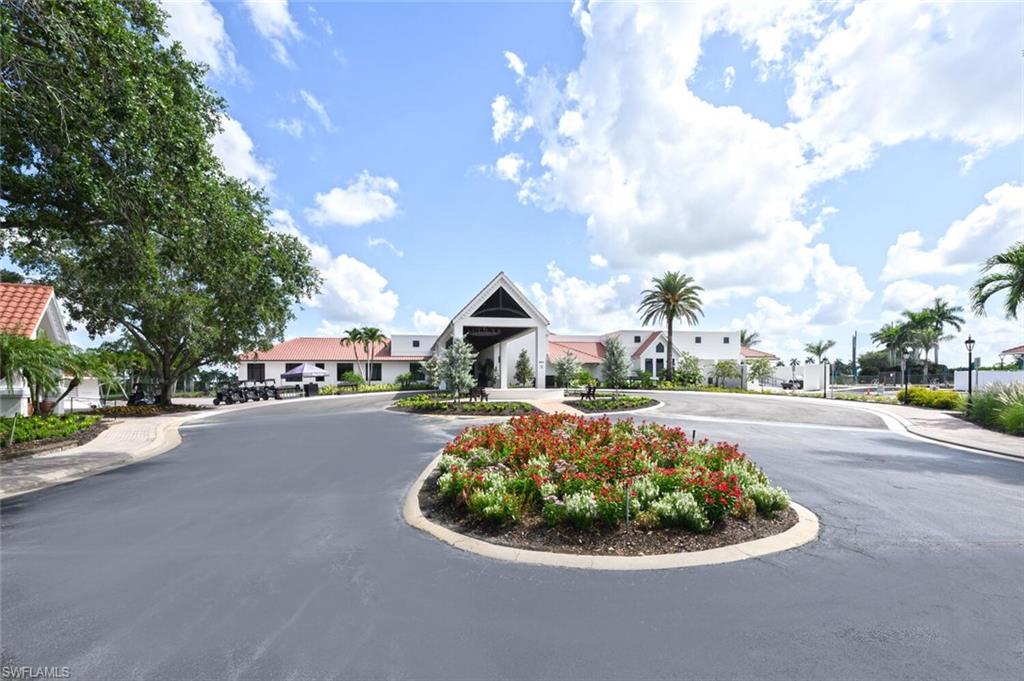 209 Countryside Drive Naples, FL 34104 - Photo 34 of 50 View of asphalt road featuring sidewalks and curbs