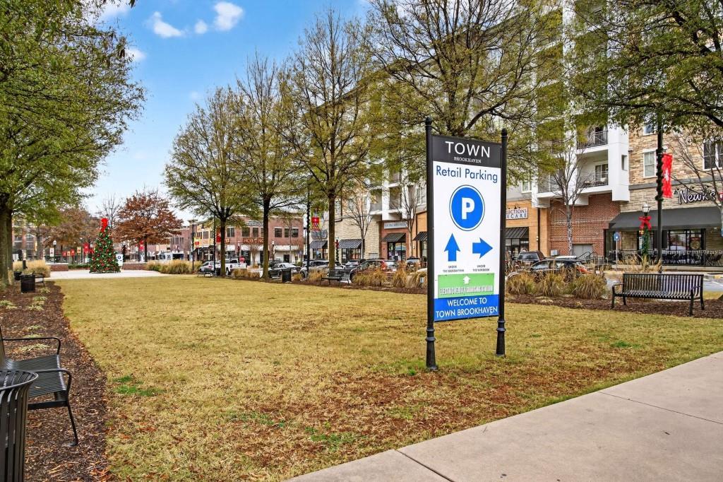 3668 Kingsboro Road Northeast, Unit 1 Atlanta, GA 30319 - Photo 27 of 43 a street sign on a sidewalk next to a road
