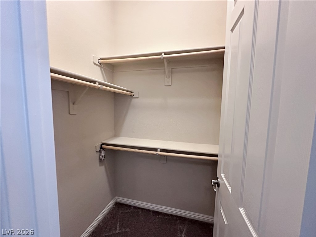 71 Newton Ridge Way Las Vegas, NV 89183 - Photo 25 of 40 Ample storage solutions are available with organized shelving and hanging rods.