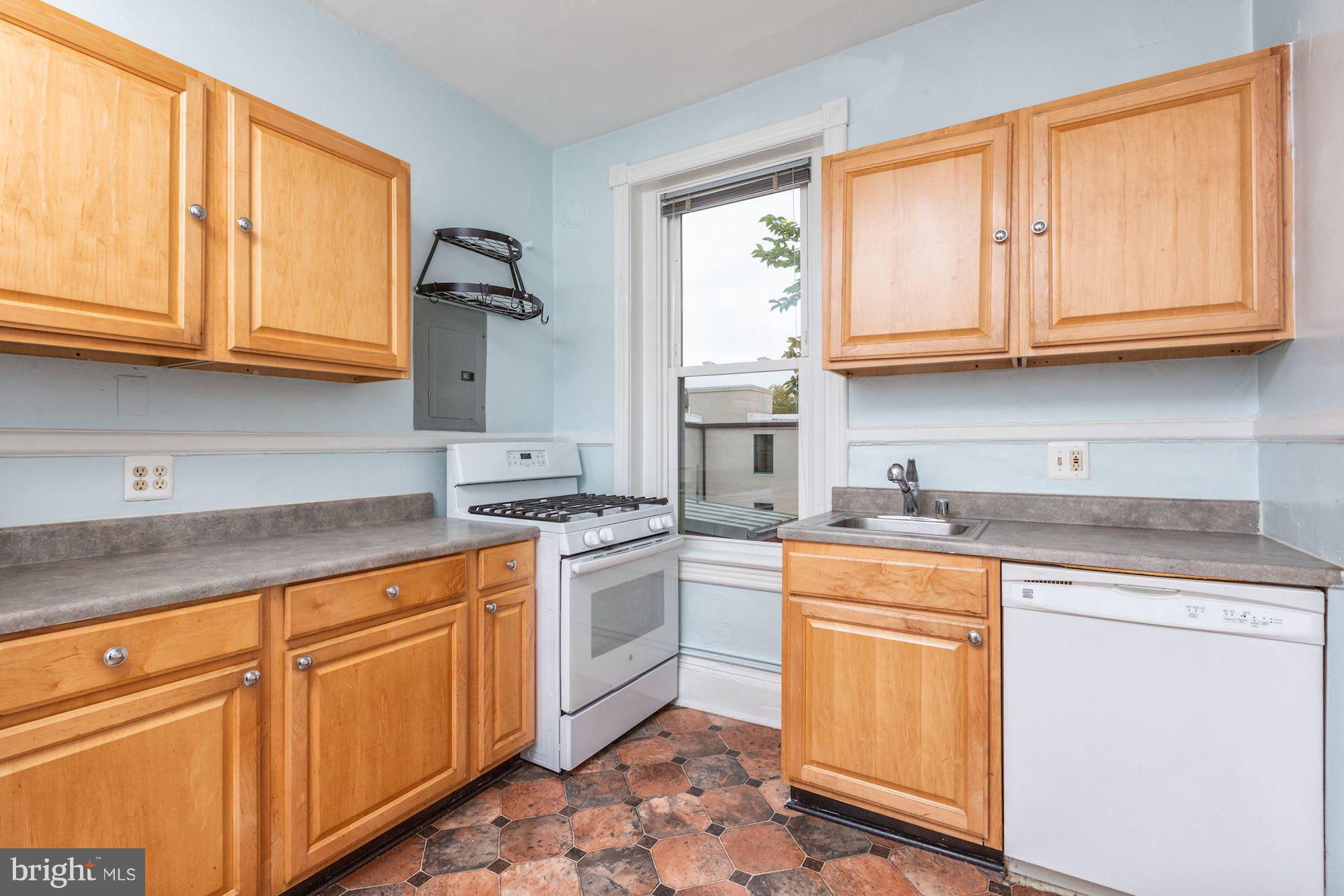 12 3rd Street Southeast Washington, DC 20003 - Photo 12 of 22 a kitchen with stainless steel appliances granite countertop a sink stove and cabinets
