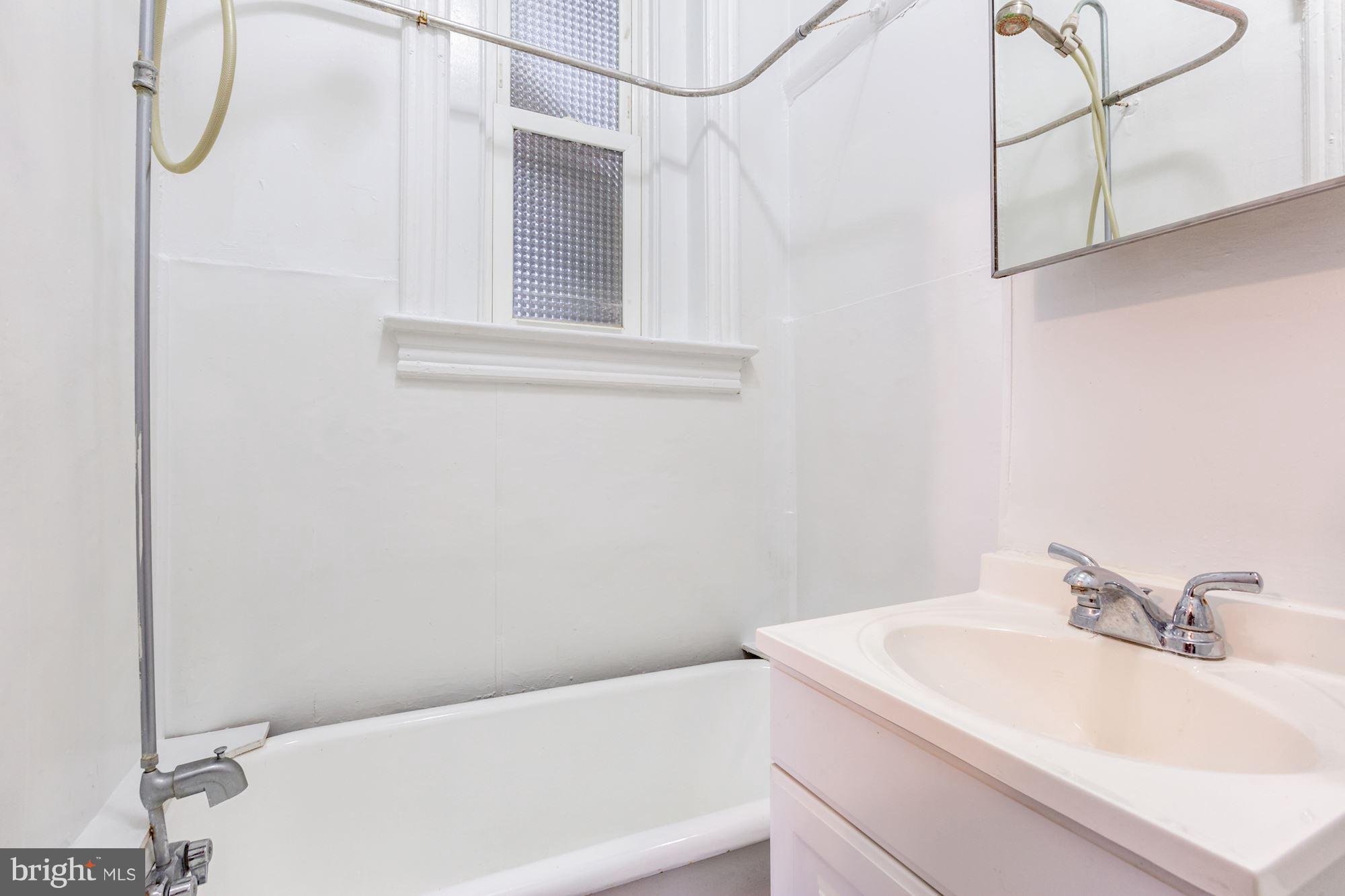 12 3rd Street Southeast Washington, DC 20003 - Photo 15 of 22 a bathroom with a sink and vanity