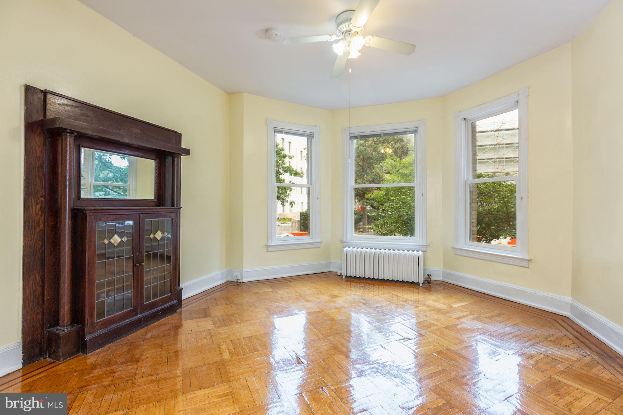 12 3rd Street Southeast Washington, DC 20003 - Photo 16 of 22 a view of livingroom with window ceiling fan and windows