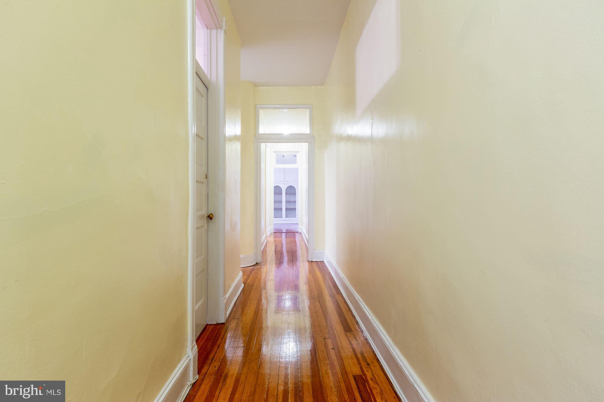 12 3rd Street Southeast Washington, DC 20003 - Photo 18 of 22 a view of a hallway with wooden floor