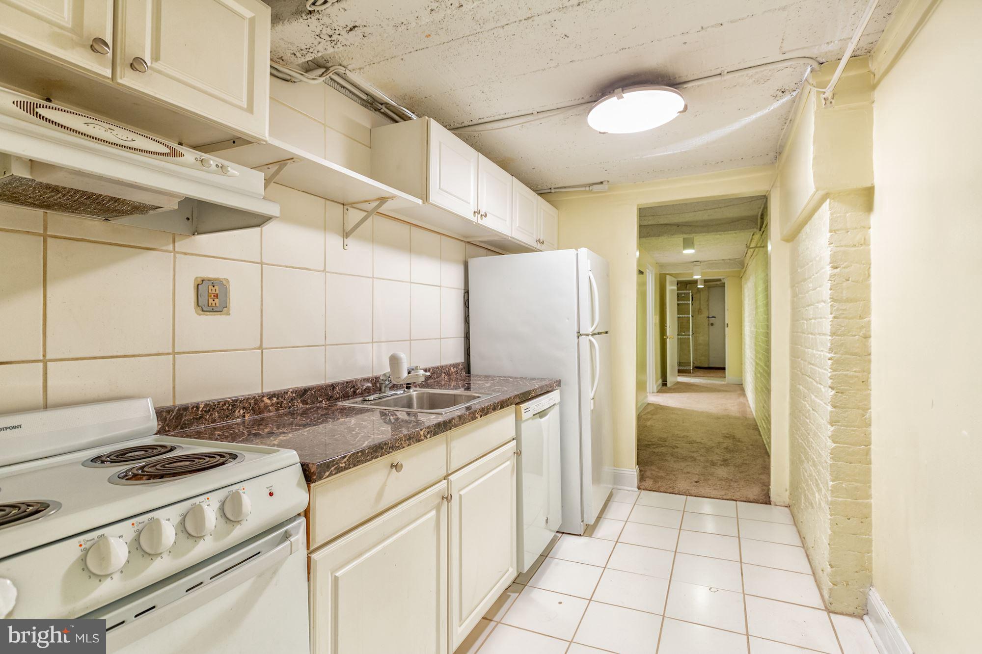 12 3rd Street Southeast Washington, DC 20003 - Photo 21 of 22 a kitchen with a stove and a refrigerator