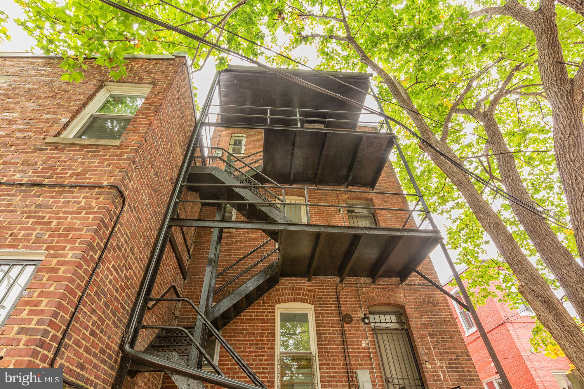 12 3rd Street Southeast Washington, DC 20003 - Photo 22 of 22 a front view of a house with a yard