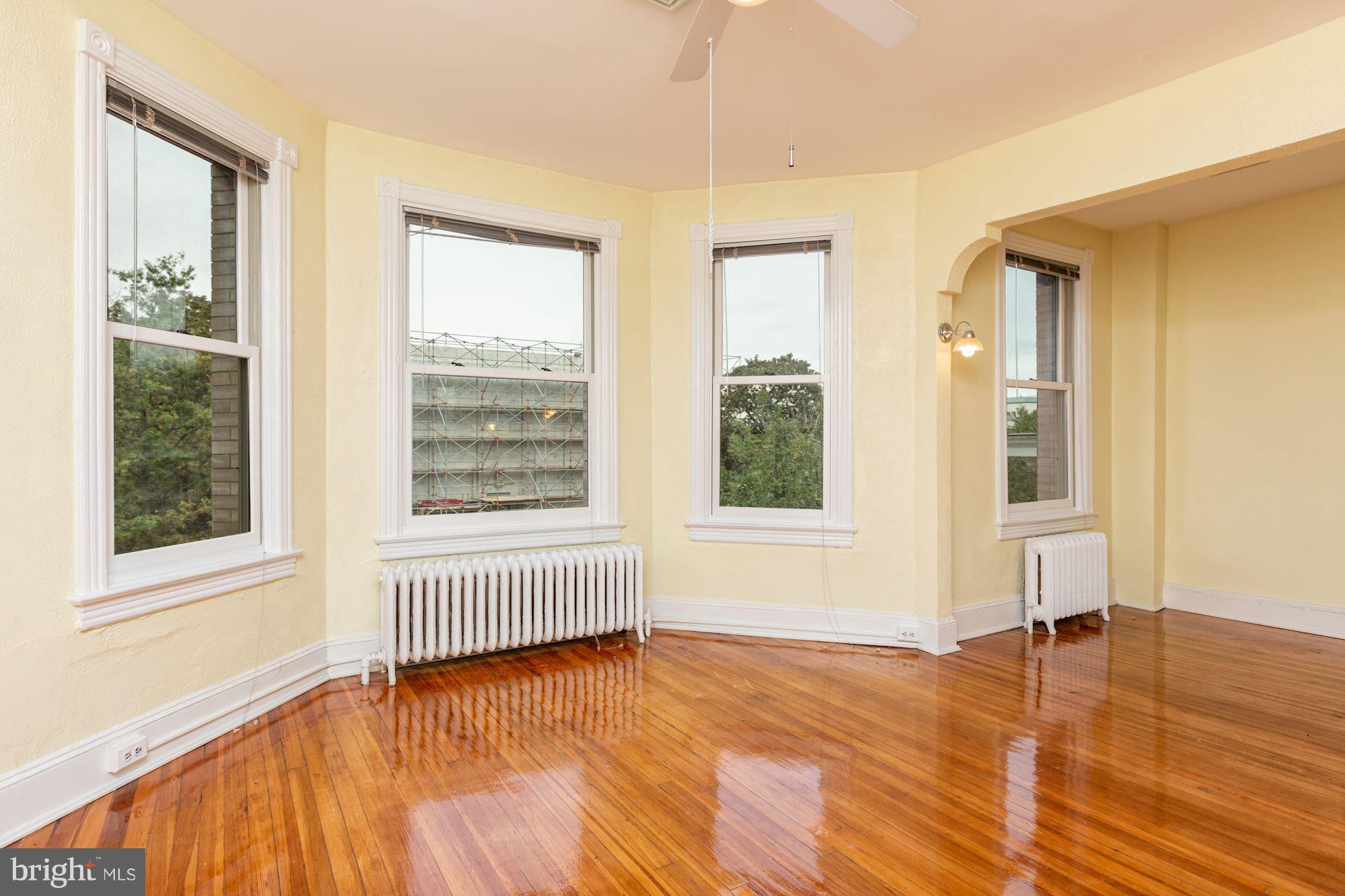 12 3rd Street Southeast Washington, DC 20003 - Photo 9 of 22 a view of an empty room with wooden floor and a window