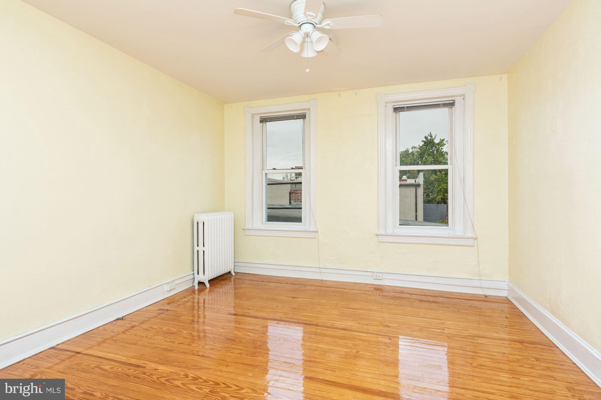 12 3rd Street Southeast Washington, DC 20003 - Photo 10 of 22 a view of empty room with wooden floor and fan