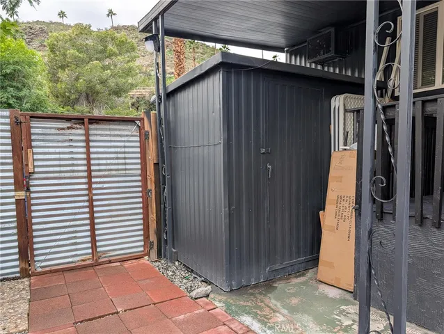 a wooden door with an outdoor space